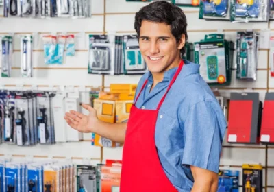 depositphotos_57459297-stock-photo-young-vendor-welcoming-at-hardware